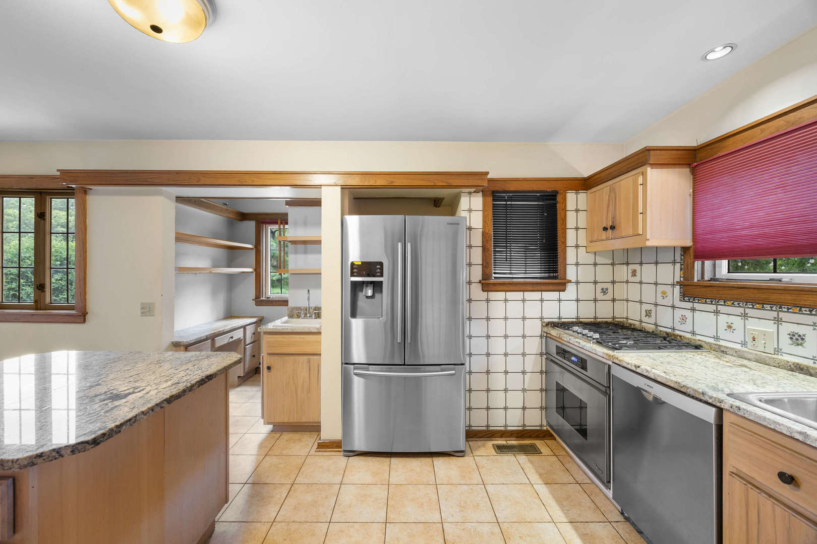 260 Maplewood Road Riverside, IL 60546 - Photo 13 of 48 a kitchen with stainless steel appliances granite countertop a refrigerator and a sink