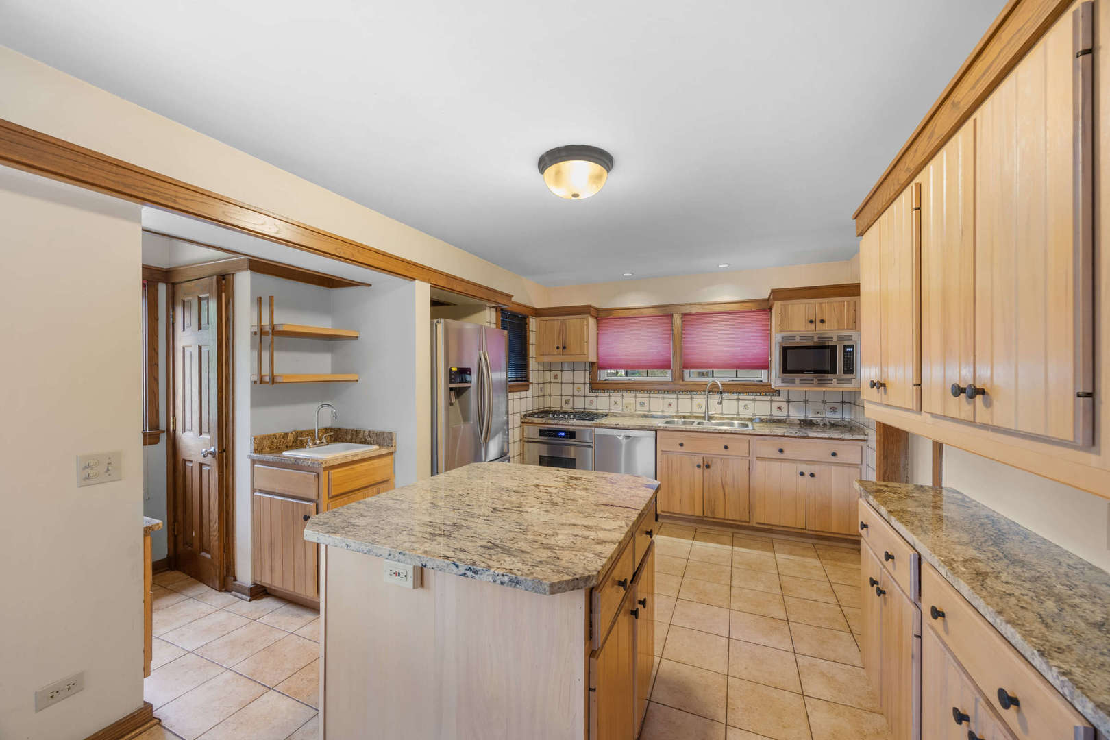 260 Maplewood Road Riverside, IL 60546 - Photo 14 of 48 a kitchen with a stove a sink and a refrigerator