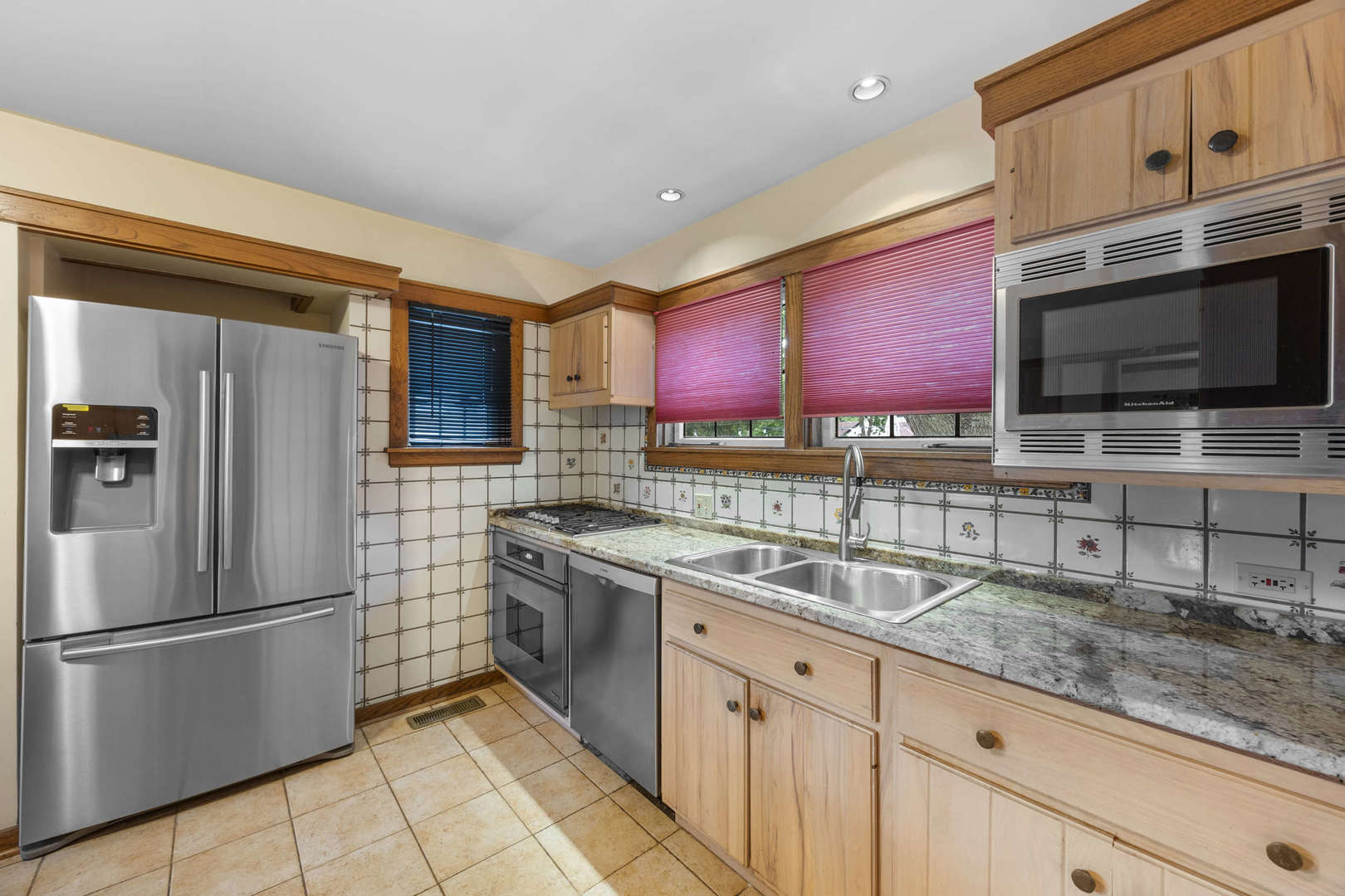 260 Maplewood Road Riverside, IL 60546 - Photo 16 of 48 a kitchen with stainless steel appliances granite countertop a sink stove and refrigerator