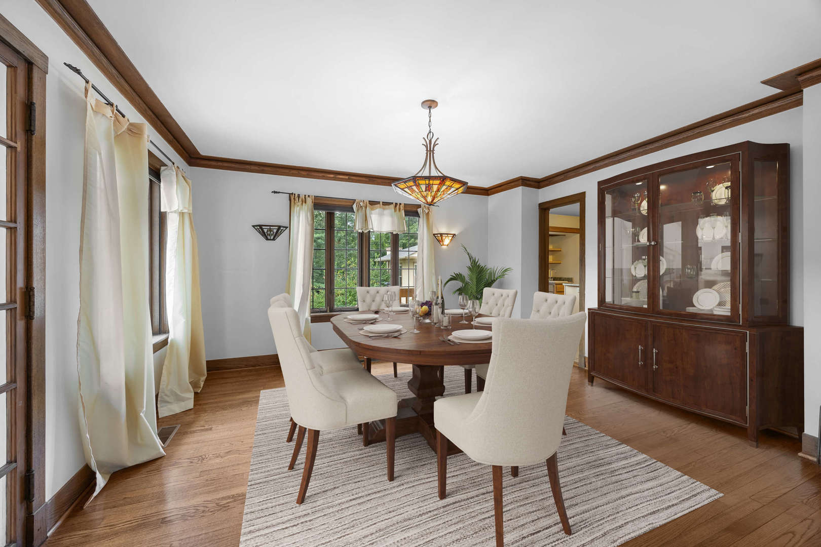260 Maplewood Road Riverside, IL 60546 - Photo 17 of 48 a dining room with furniture a chandelier and wooden floor
