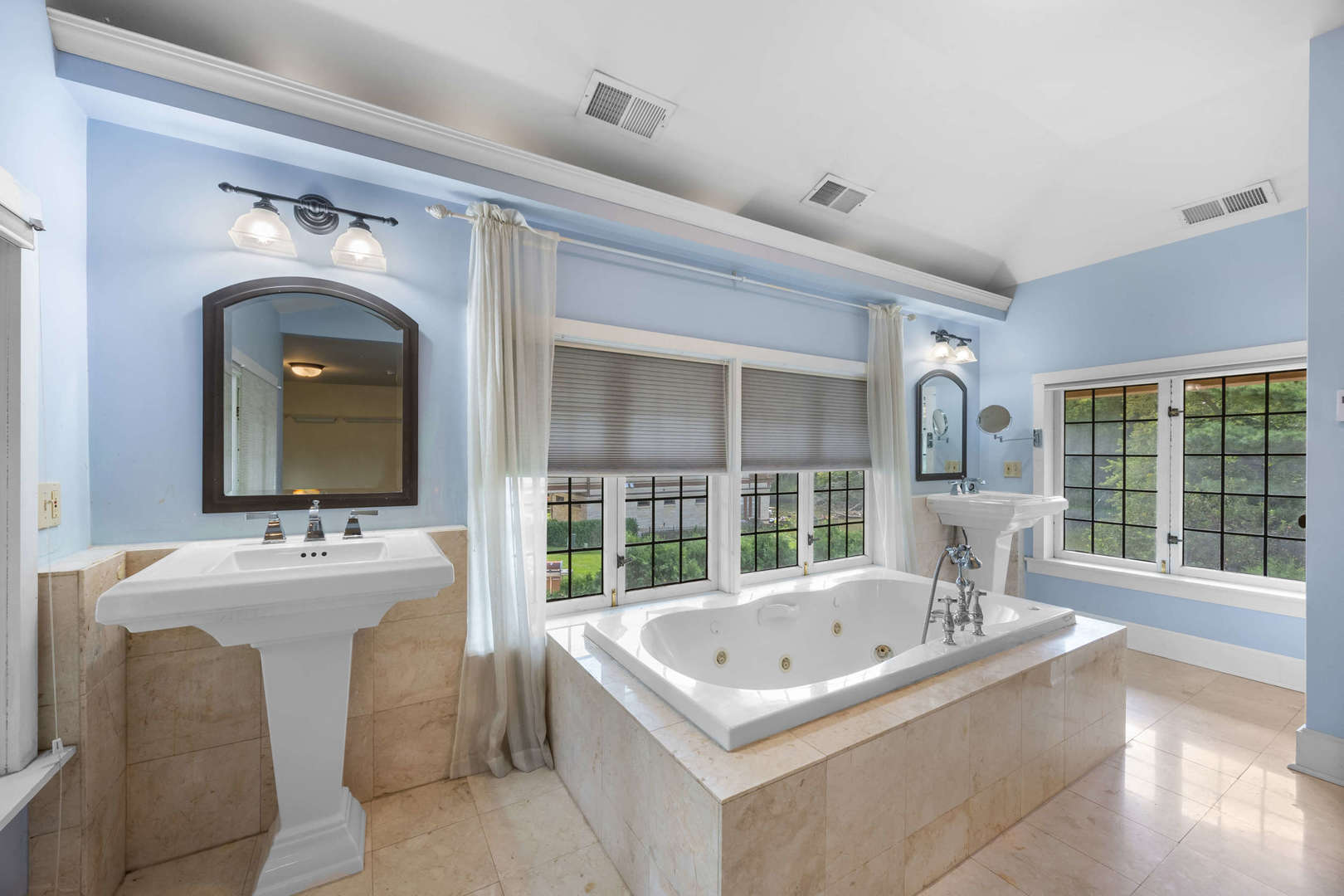 260 Maplewood Road Riverside, IL 60546 - Photo 24 of 48 a bathroom with a sink and a large mirror