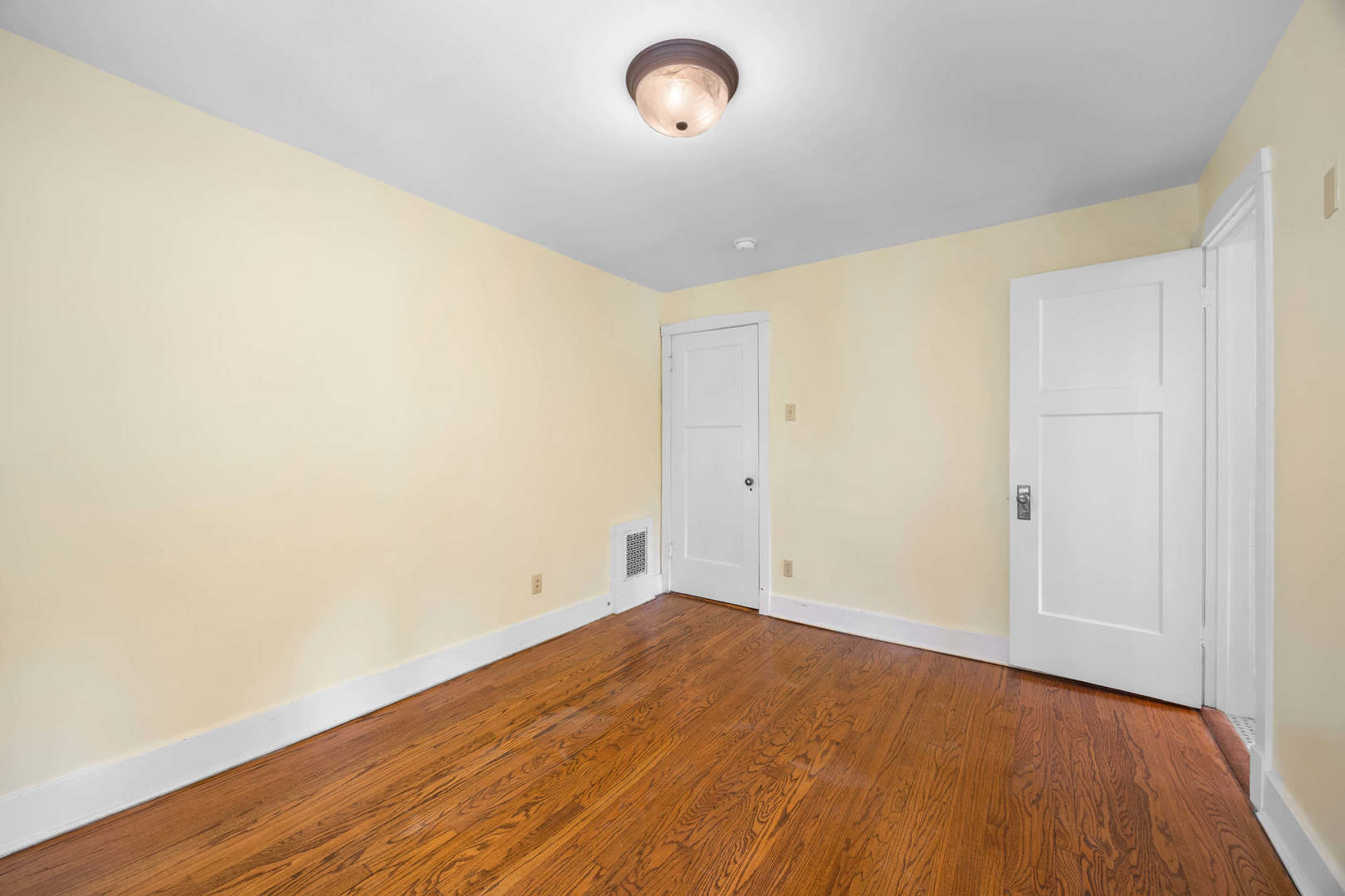 260 Maplewood Road Riverside, IL 60546 - Photo 29 of 48 an empty room with wooden floor and windows
