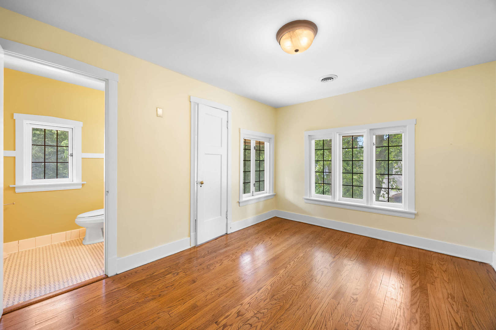 260 Maplewood Road Riverside, IL 60546 - Photo 31 of 48 a view of an empty room with wooden floor and a window