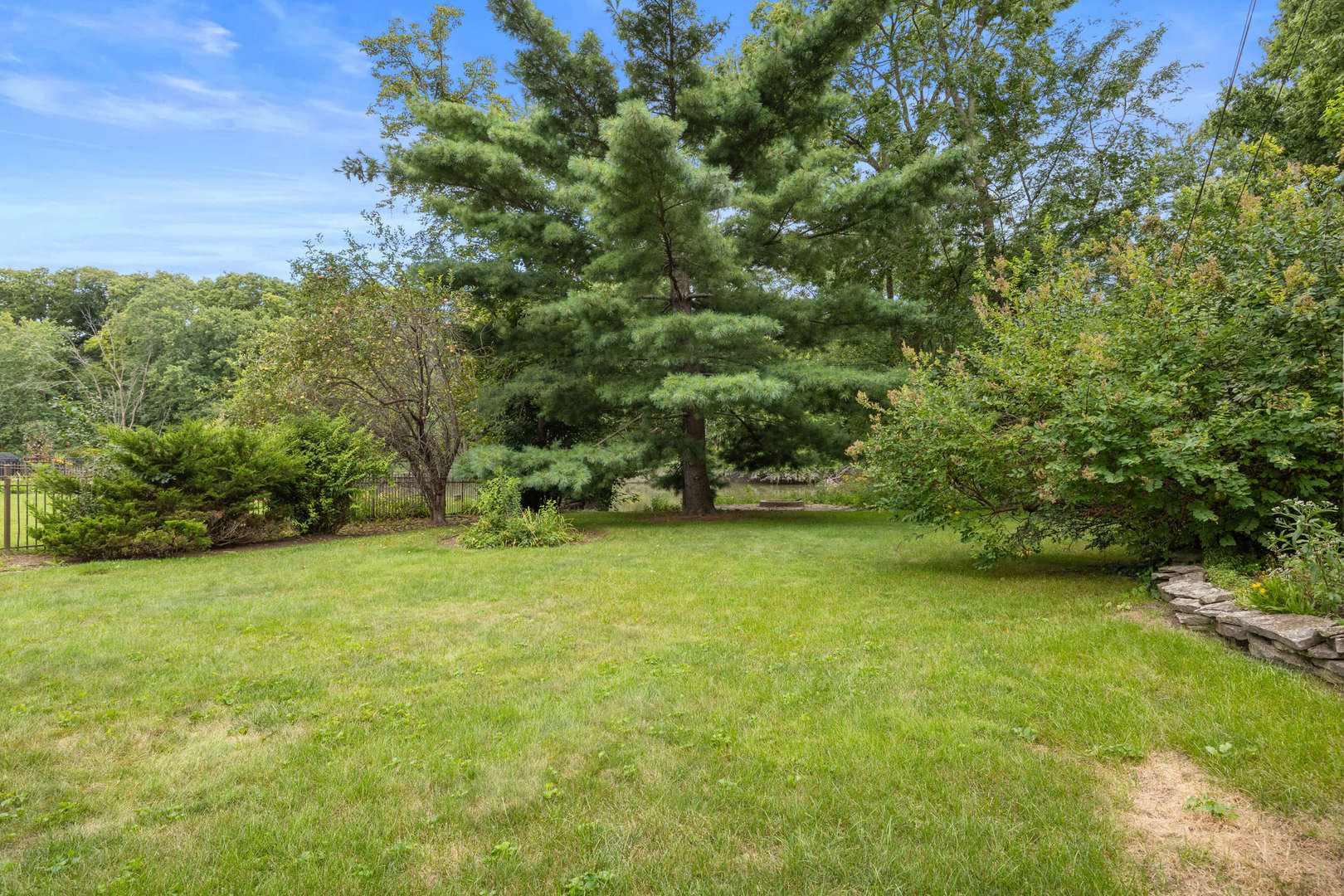 260 Maplewood Road Riverside, IL 60546 - Photo 45 of 48 a view of a field with trees in the background
