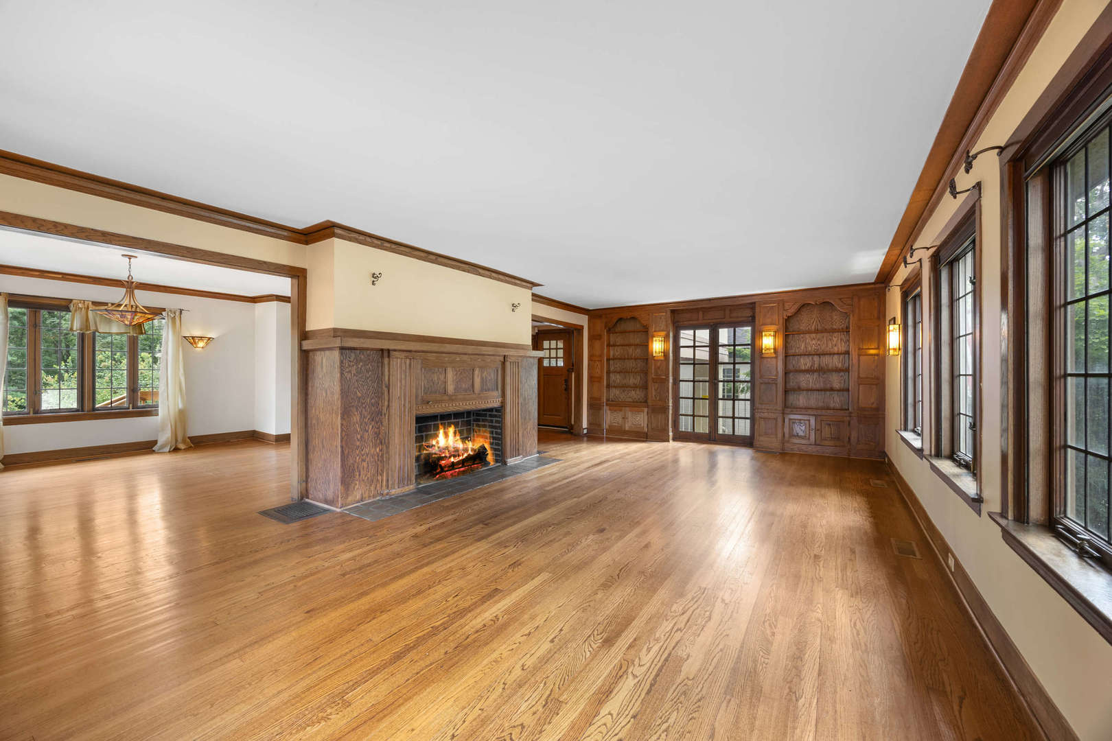 260 Maplewood Road Riverside, IL 60546 - Photo 5 of 48 a view of an empty room with wooden floor and a window