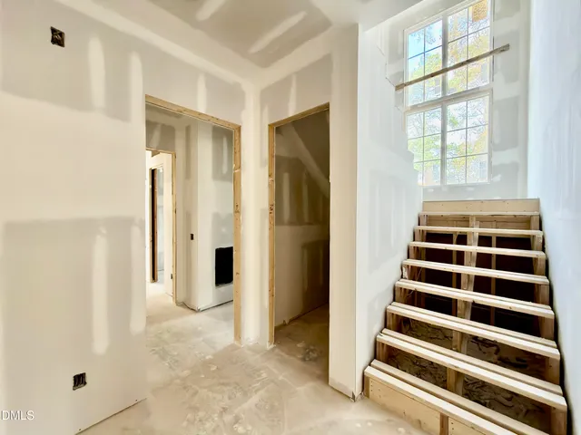 a view of a backyard with large trees