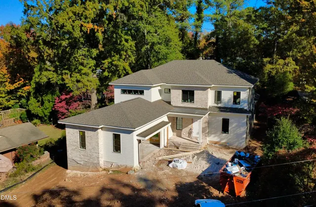 a aerial view of a house with a yard