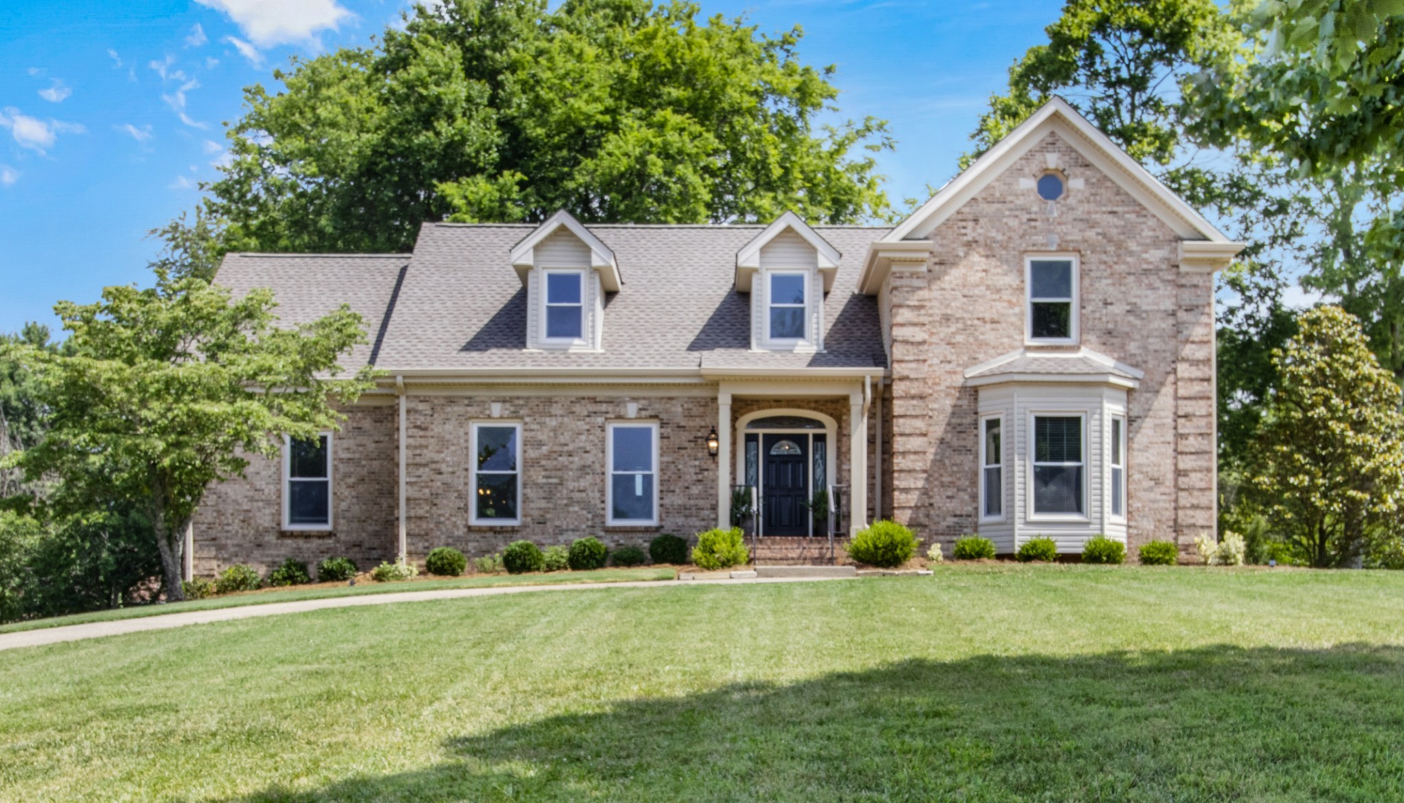 front view of a house with a yard