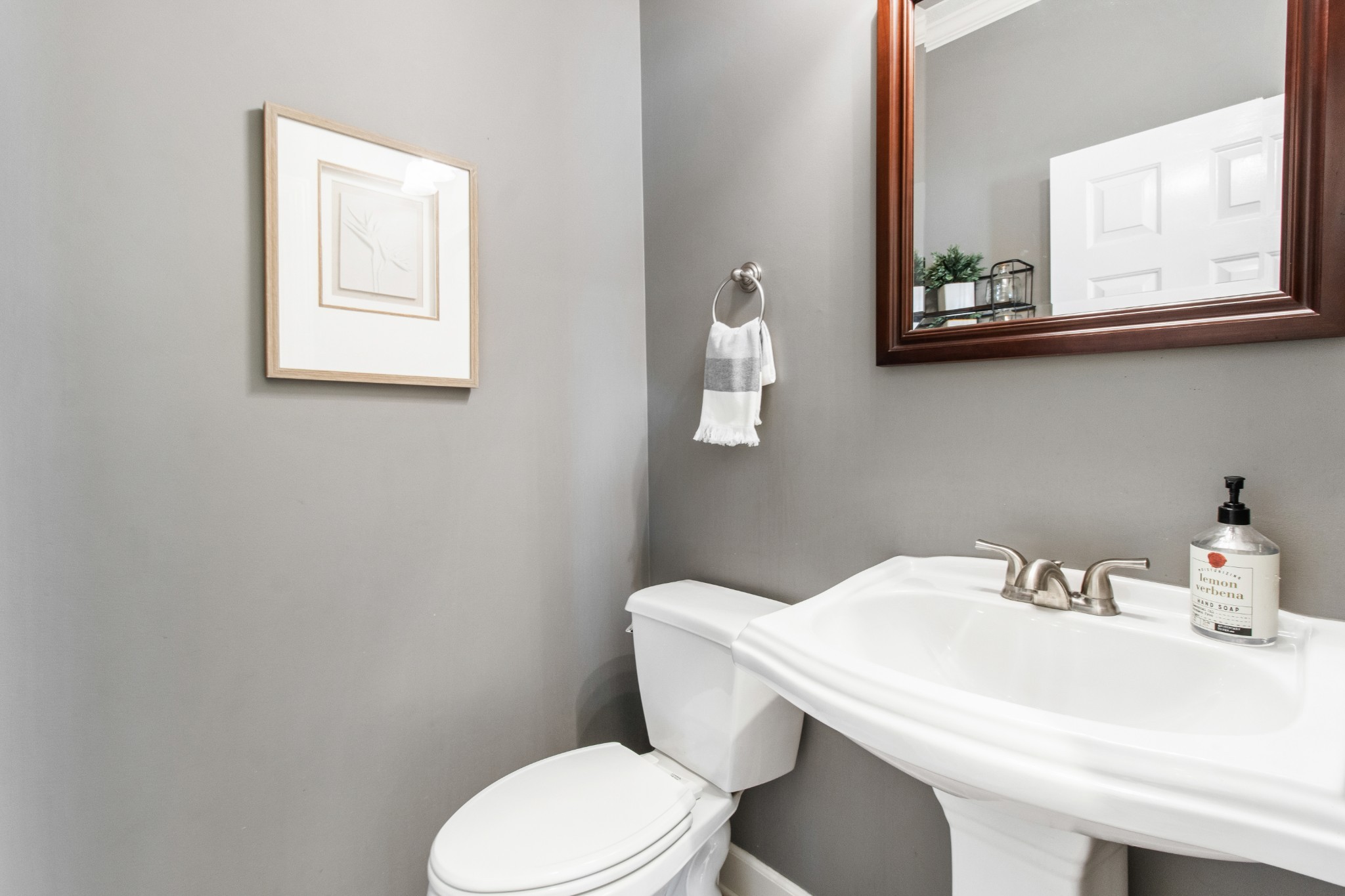 2203 Springlot Road Clarksville, TN 37043 - Photo 19 of 36 a bathroom with a sink a toilet and mirror