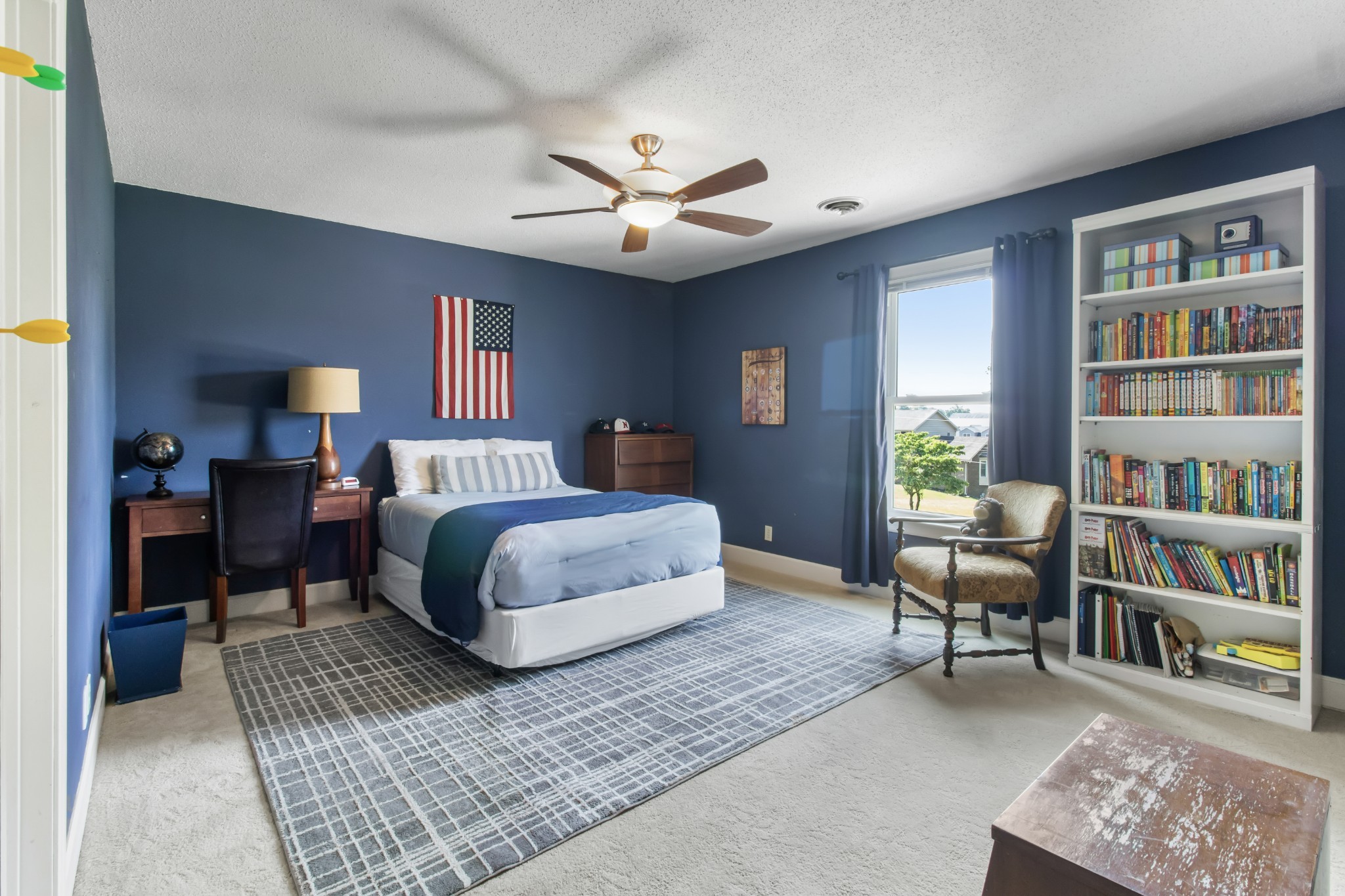 2203 Springlot Road Clarksville, TN 37043 - Photo 25 of 36 a bedroom with a bed furniture and a book shelf