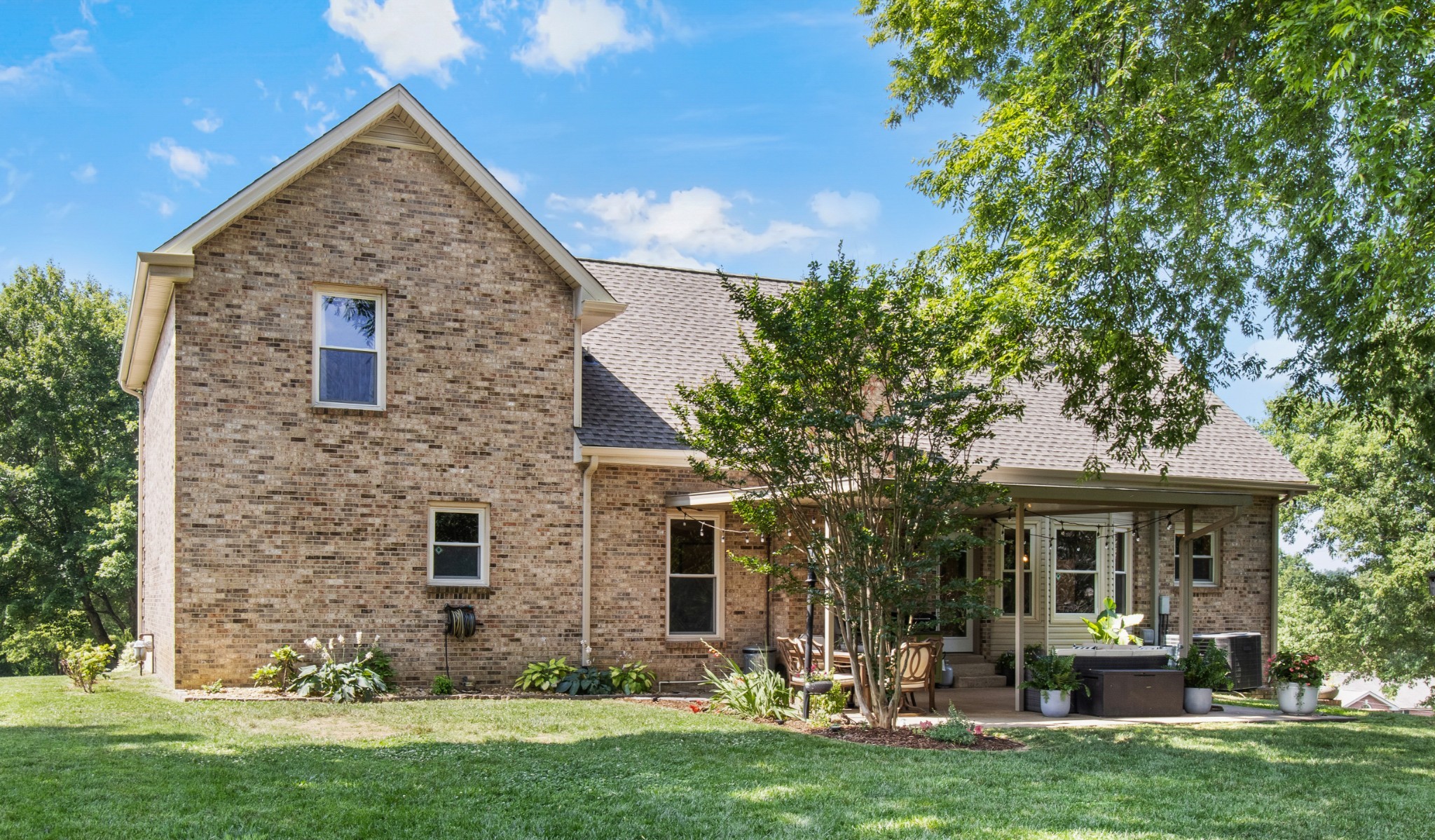 2203 Springlot Road Clarksville, TN 37043 - Photo 34 of 36 a front view of a house with a garden and plants