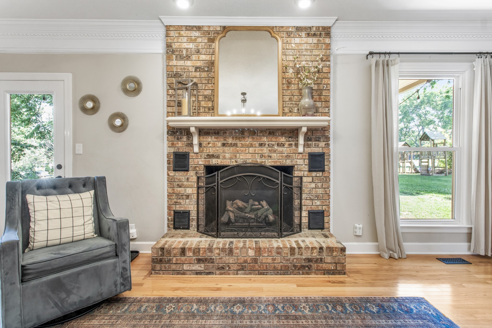 2203 Springlot Road Clarksville, TN 37043 - Photo 7 of 36 a living room with furniture and a fireplace