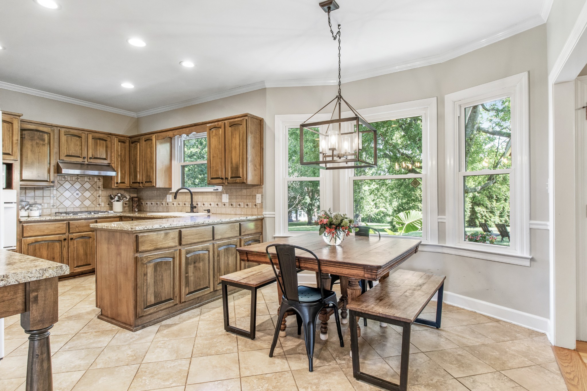 2203 Springlot Road Clarksville, TN 37043 - Photo 9 of 36 a kitchen with sink cabinets dining table and chairs