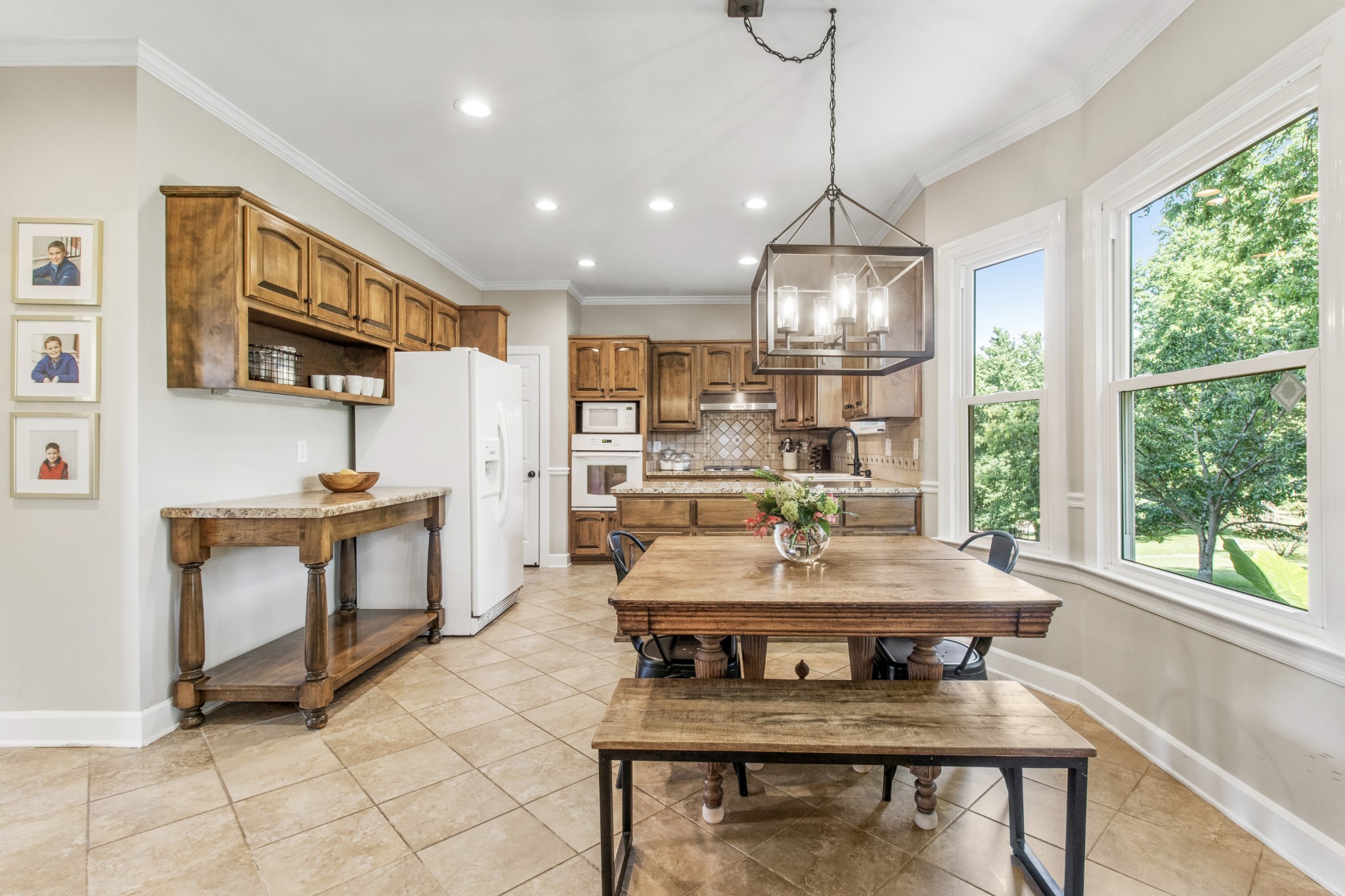 2203 Springlot Road Clarksville, TN 37043 - Photo 10 of 36 a dining room with a large window a table and chairs