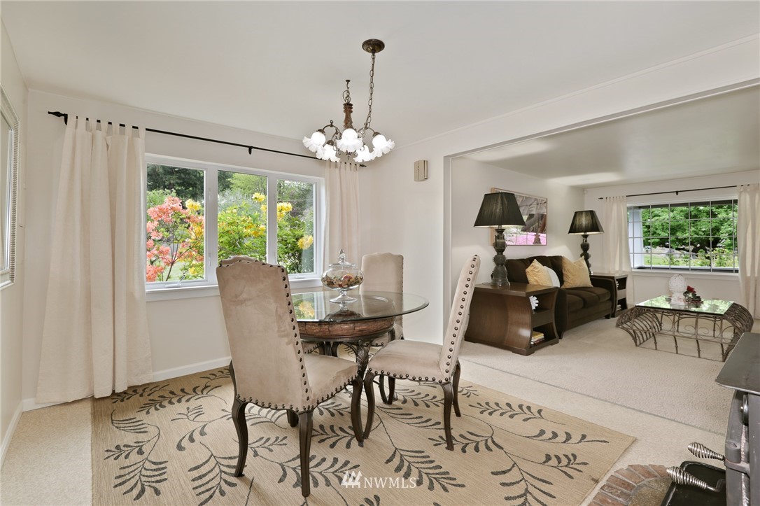 4440 Preston-Fall City Road Southeast Fall City, WA 98024 - Photo 6 of 38 a living room with furniture and a chandelier