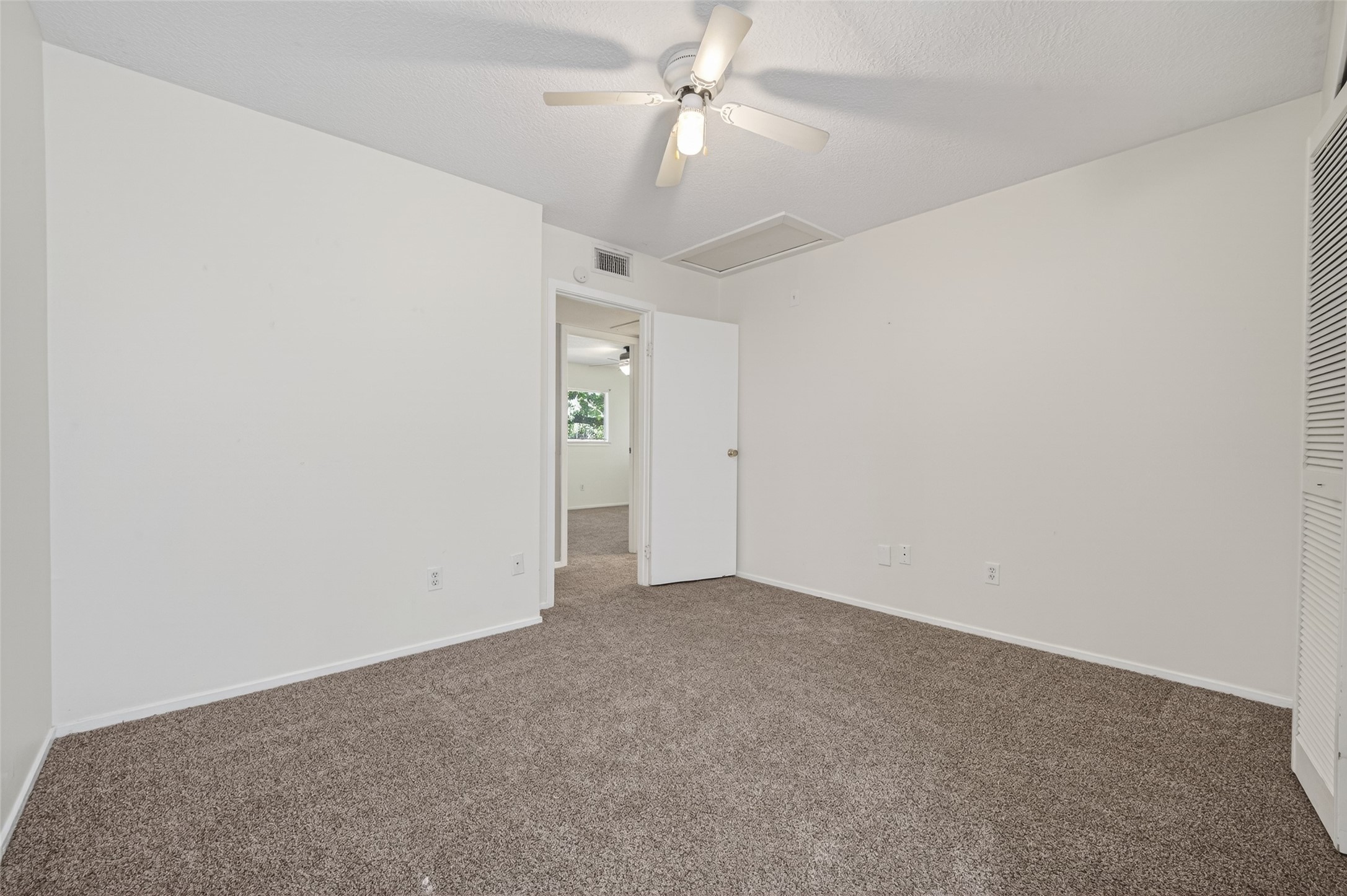 1106 East Red Cedar Circle Spring, TX 77380 - Photo 27 of 43 an empty room with a ceiling fan and a fan