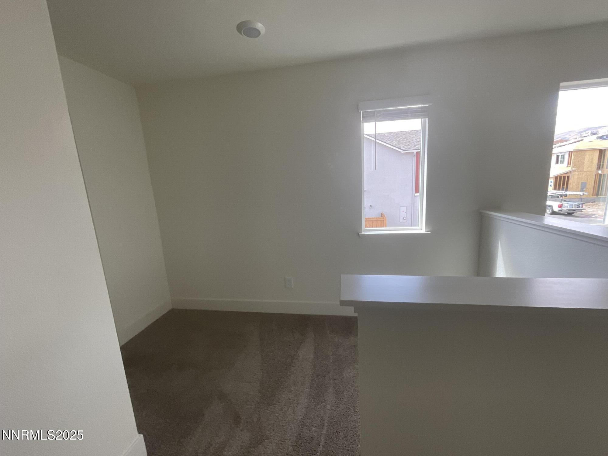 4128 Scenic Drive Reno, NV 89523 - Photo 15 of 20 an empty room with wooden floor and windows