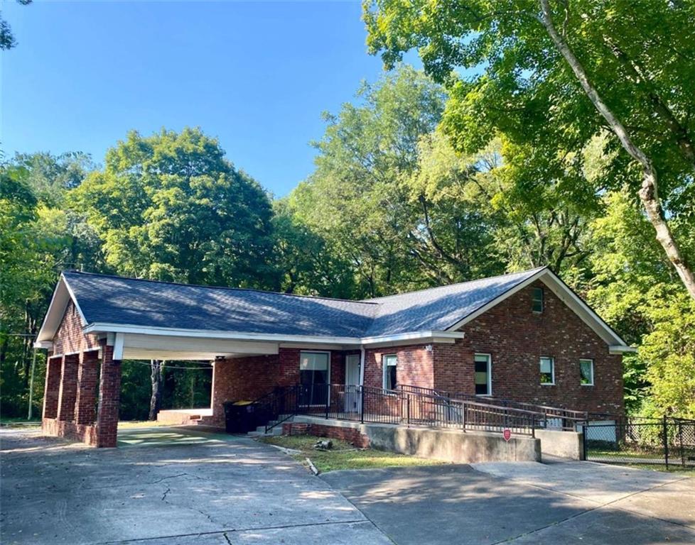 4 Colonial Drive Rome, GA 30165 - Photo 1 of 31 a front view of house with yard and trees in the background