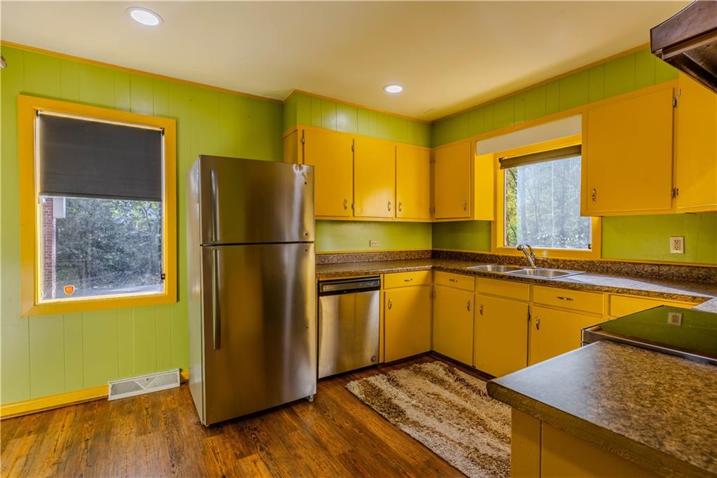 4 Colonial Drive Rome, GA 30165 - Photo 11 of 31 a kitchen with stainless steel appliances granite countertop a refrigerator a sink and a stove
