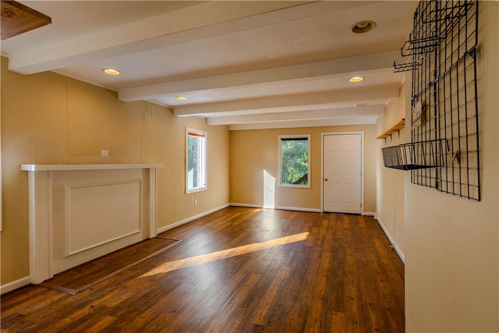 4 Colonial Drive Rome, GA 30165 - Photo 13 of 31 an empty room with wooden floor and windows