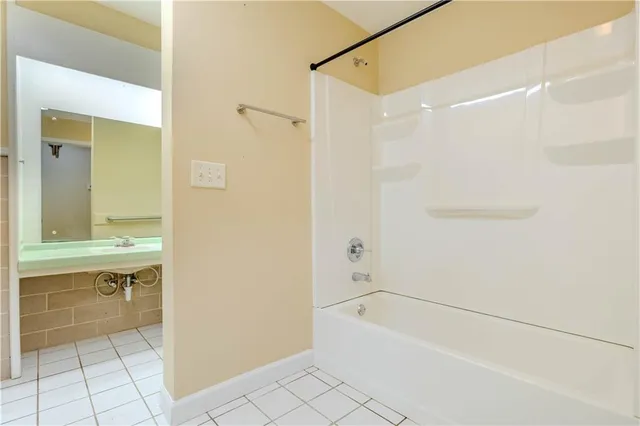 a bathroom with a bathtub and a sink