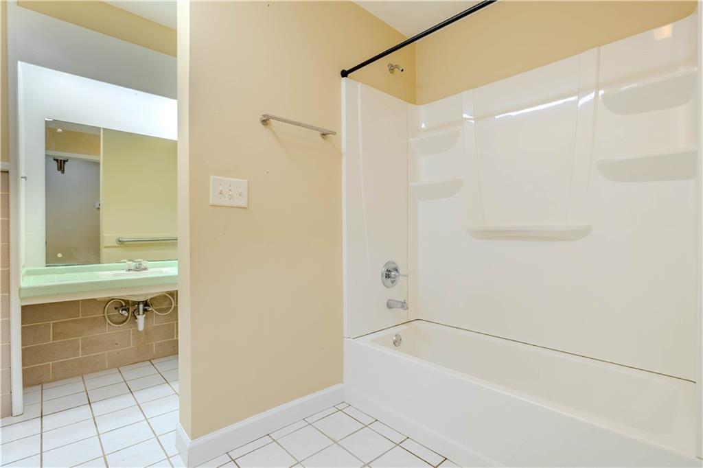 4 Colonial Drive Rome, GA 30165 - Photo 18 of 31 a bathroom with a bathtub and a sink