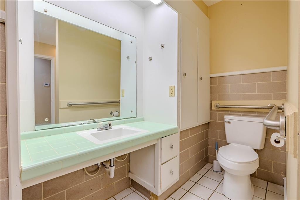4 Colonial Drive Rome, GA 30165 - Photo 19 of 31 a bathroom with a sink a toilet and shower