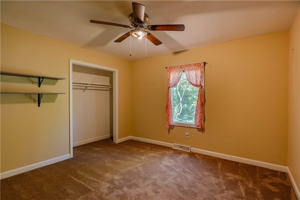 4 Colonial Drive Rome, GA 30165 - Photo 22 of 31 an empty room with windows and fan