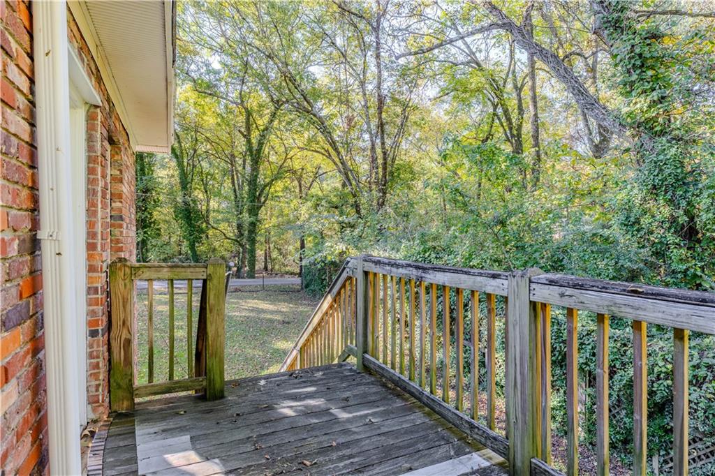 4 Colonial Drive Rome, GA 30165 - Photo 27 of 31 a view of balcony with wooden floor and fence