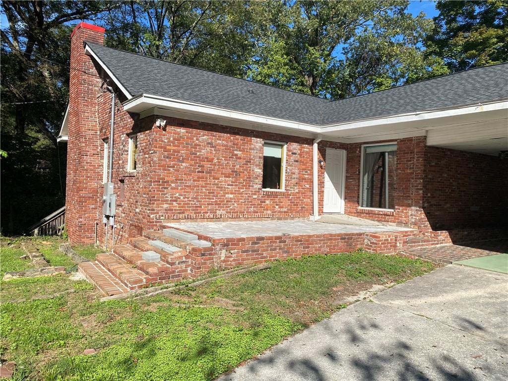 4 Colonial Drive Rome, GA 30165 - Photo 3 of 31 a backyard of a house with yard and outdoor seating