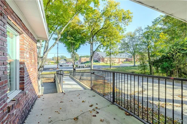 a view of swimming pool from a balcony