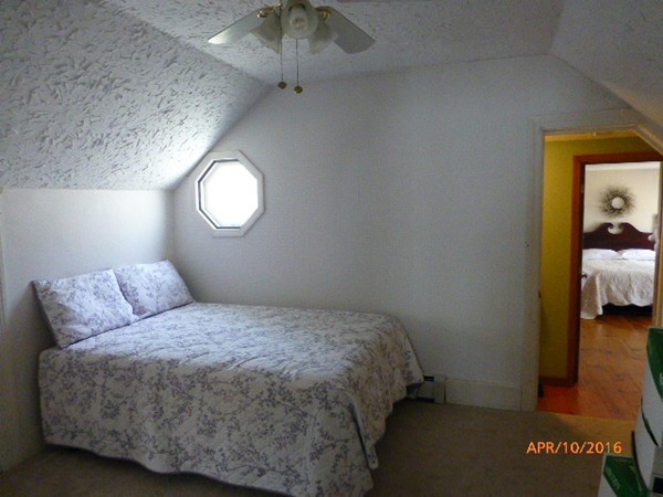 1 Cuba Road Worcester, MA 01603 - Photo 13 of 15 a bedroom with a bed and a window