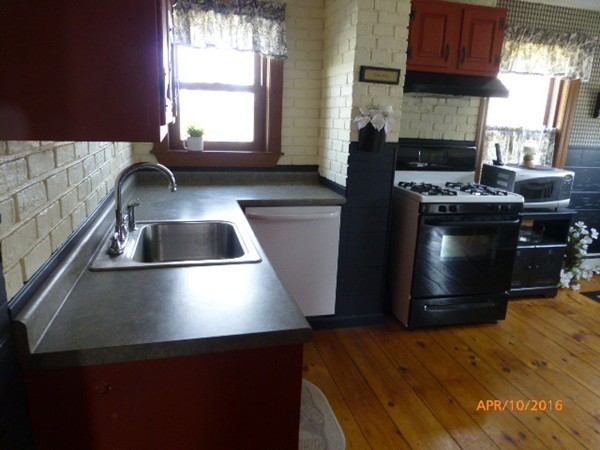 1 Cuba Road Worcester, MA 01603 - Photo 7 of 15 a kitchen with granite countertop a stove and a sink