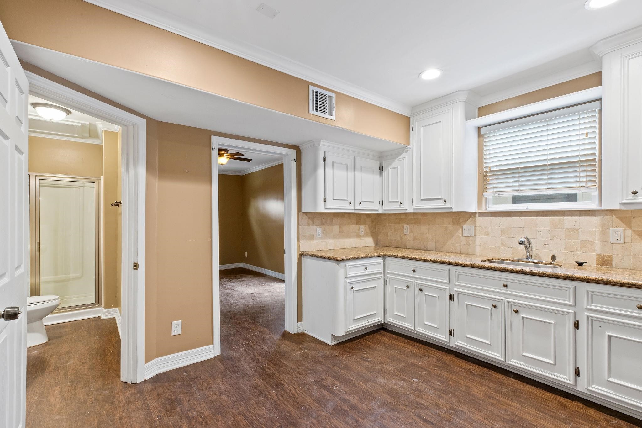 4306 Wilmer Street, Unit 2 Houston, TX 77003 - Photo 11 of 17 a view of a kitchen with sink cabinets and window
