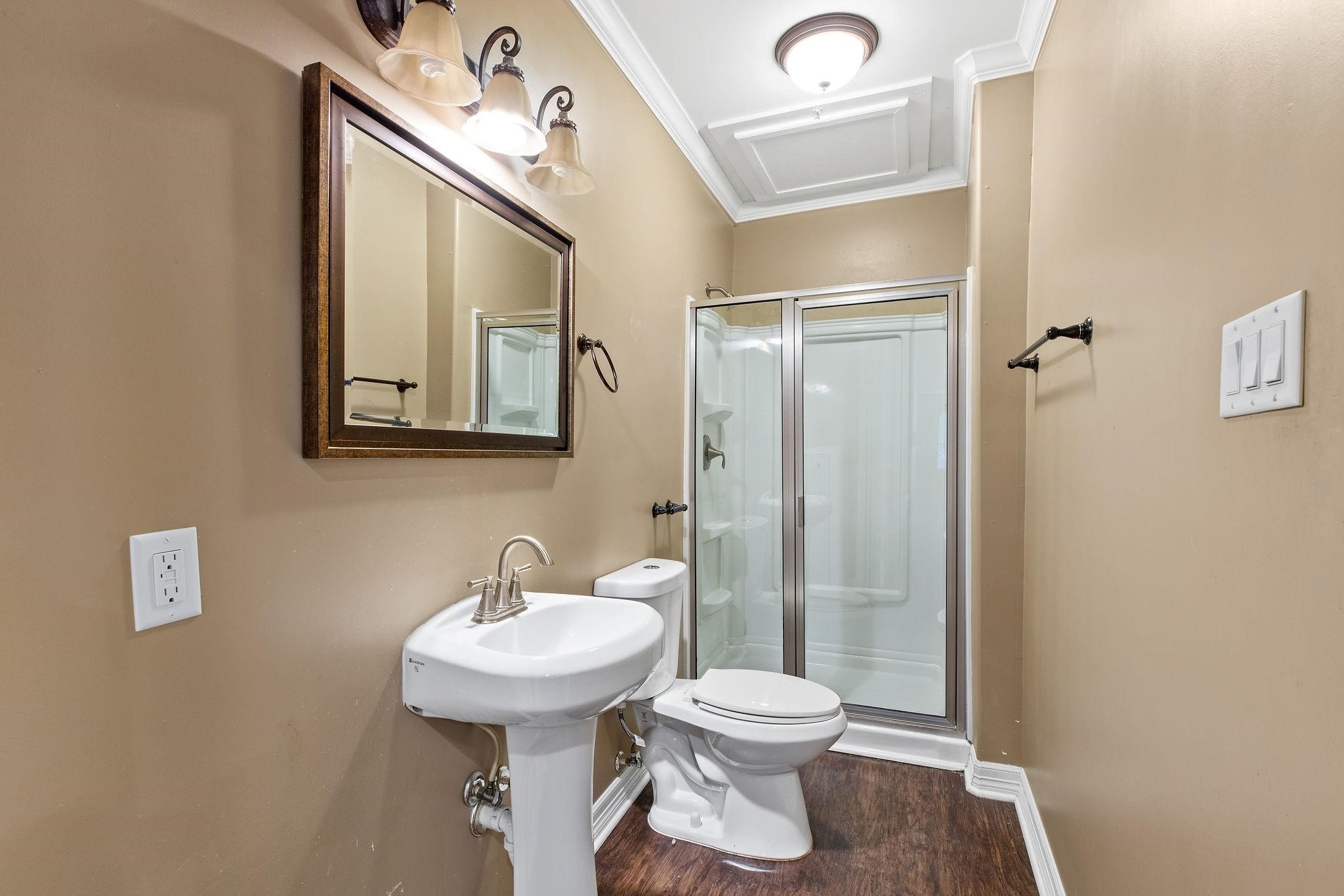 4306 Wilmer Street, Unit 2 Houston, TX 77003 - Photo 14 of 17 a bathroom with a toilet a sink and mirror