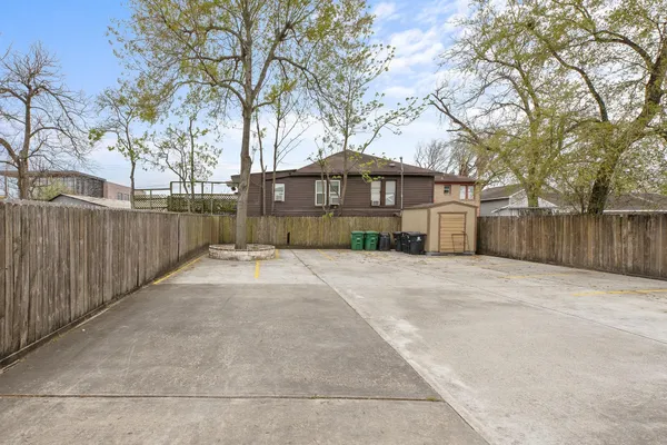 a view of a house with a yard covered with snow in the background