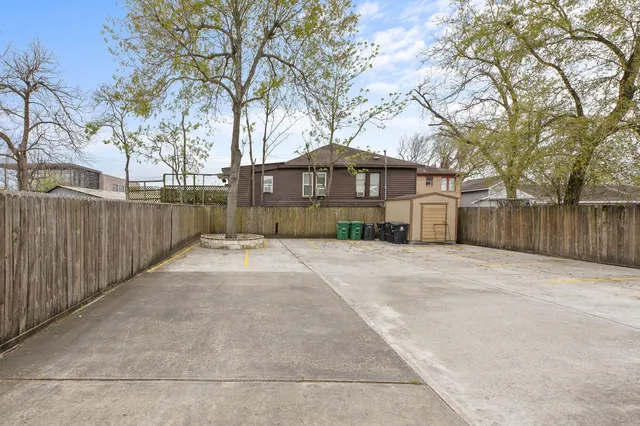 a view of a house with a yard covered with snow in the background