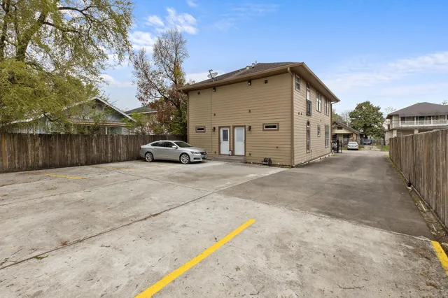 a view of a car park in front of house