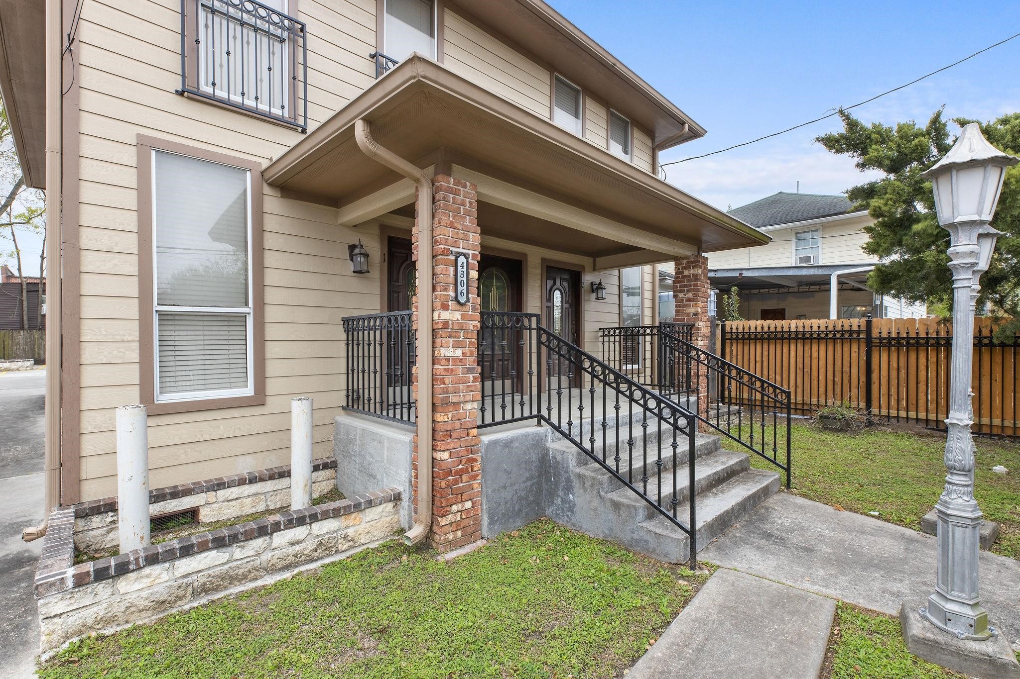 4306 Wilmer Street, Unit 2 Houston, TX 77003 - Photo 6 of 17 a view of a house with a yard and deck