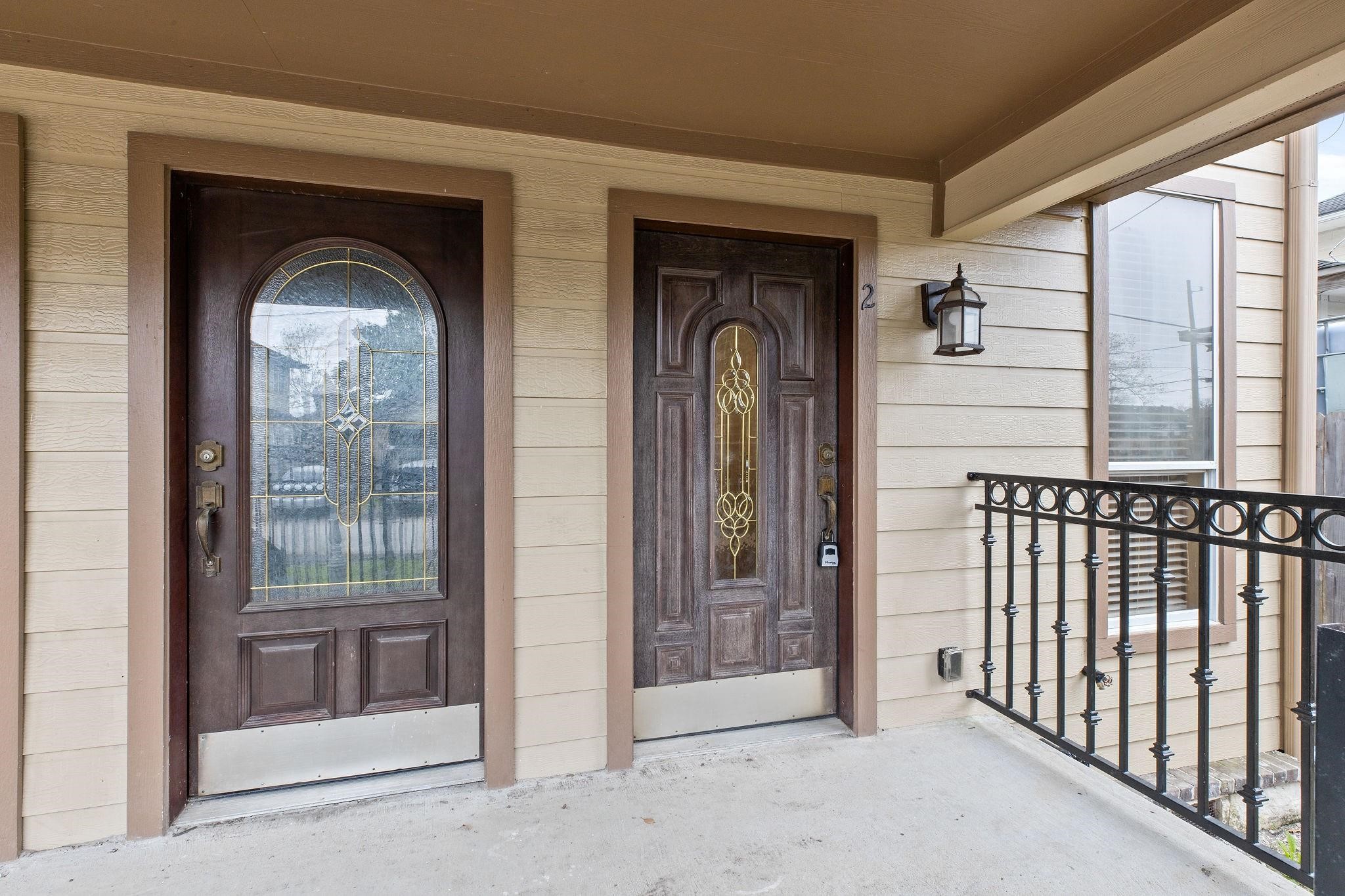 4306 Wilmer Street, Unit 2 Houston, TX 77003 - Photo 8 of 17 a front view of a house with a glass door and a porch