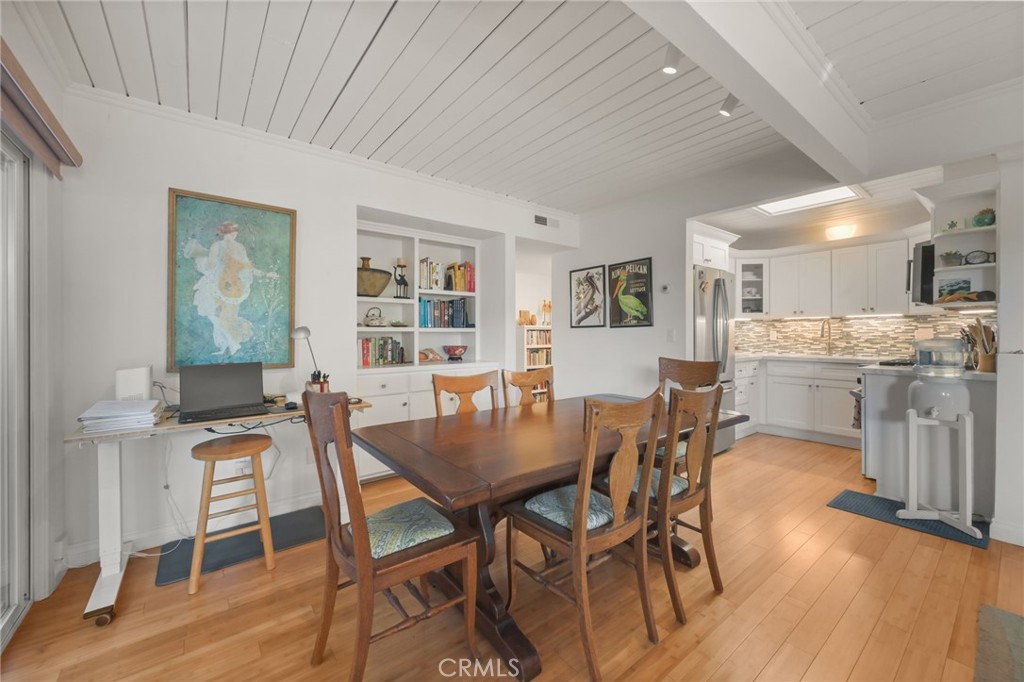 34041 El Contento Dana Point, CA 92629 - Photo 12 of 22 a view of a dining room with furniture window and wooden floor