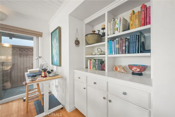 a room with cabinets and book shelf