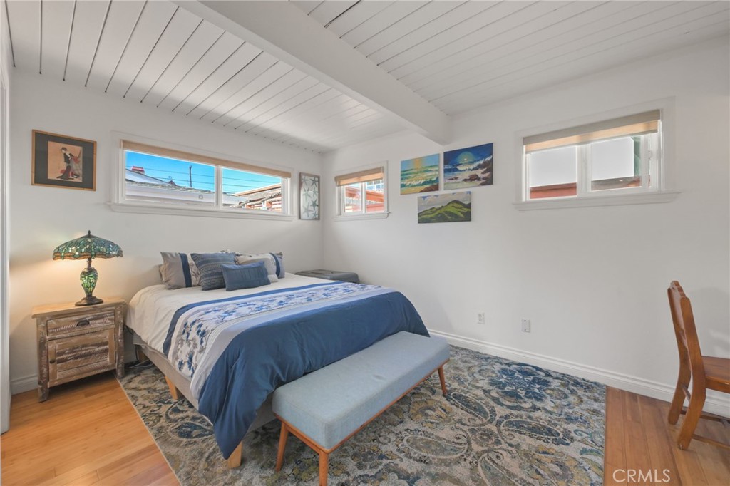 34041 El Contento Dana Point, CA 92629 - Photo 14 of 22 a bedroom with a bed and a desk