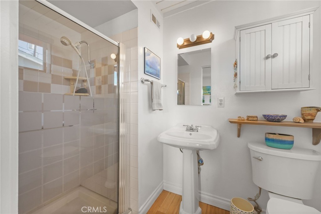 34041 El Contento Dana Point, CA 92629 - Photo 16 of 22 a bathroom with a sink a toilet and shower