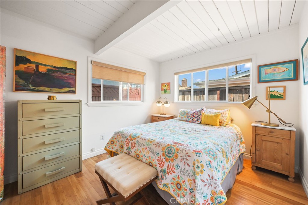 34041 El Contento Dana Point, CA 92629 - Photo 17 of 22 a bedroom with a bed and wooden floor