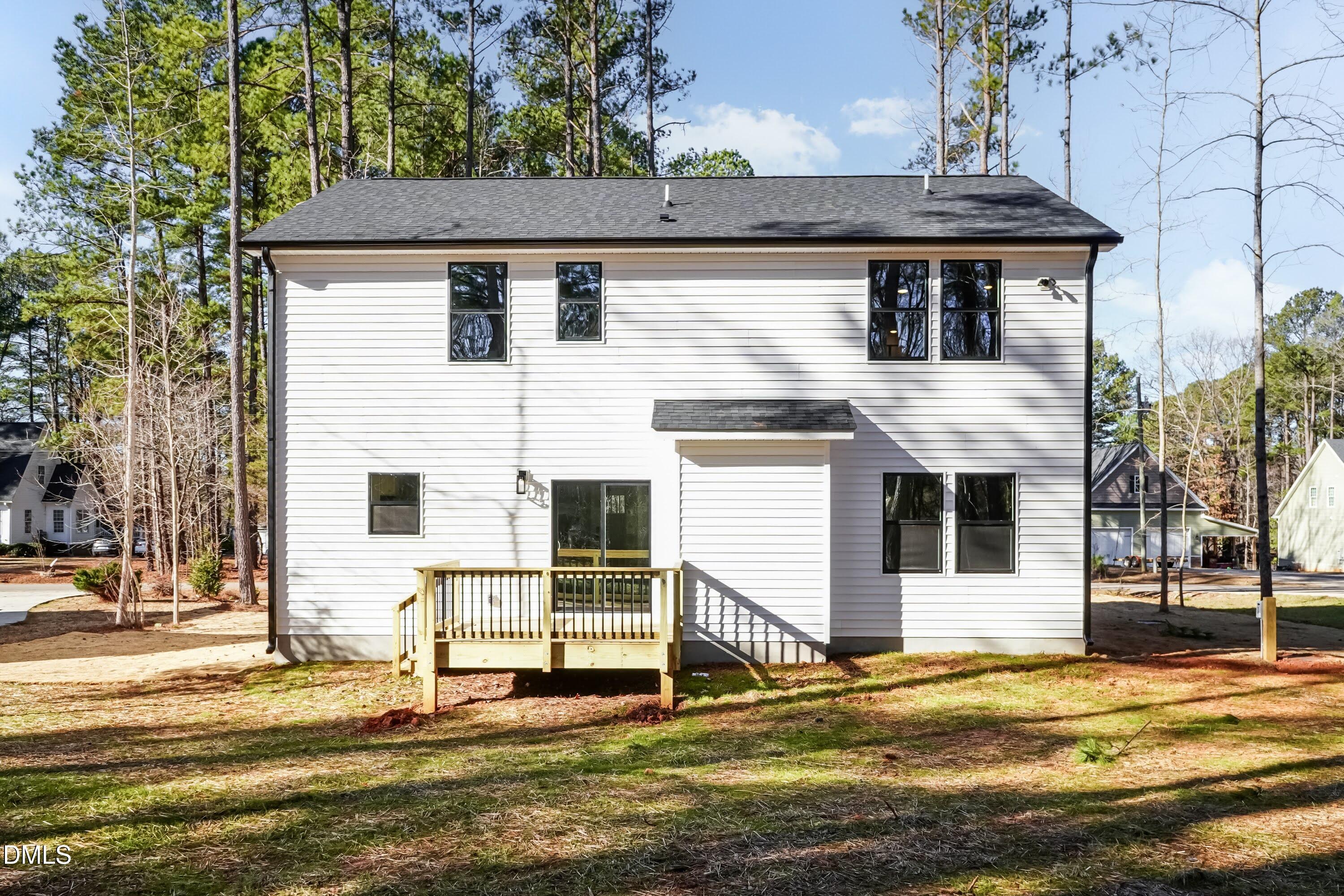 104 Buffalo Drive Spring Hope, NC 27882 - Photo 40 of 48 a view of a white house with large windows