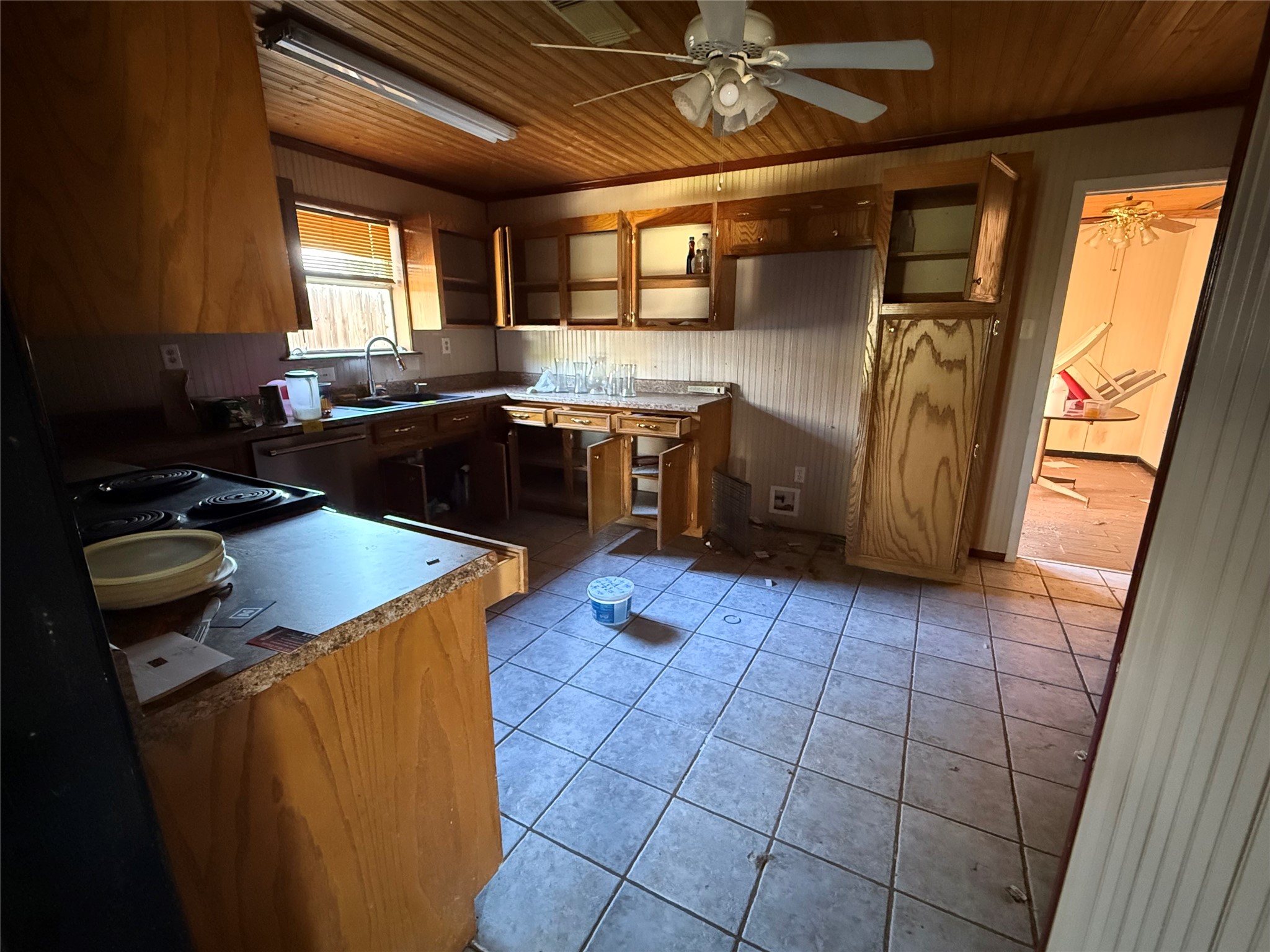 252 Bastrop Street Angleton, TX 77515 - Photo 9 of 11 a kitchen with stainless steel appliances granite countertop a sink stove and refrigerator