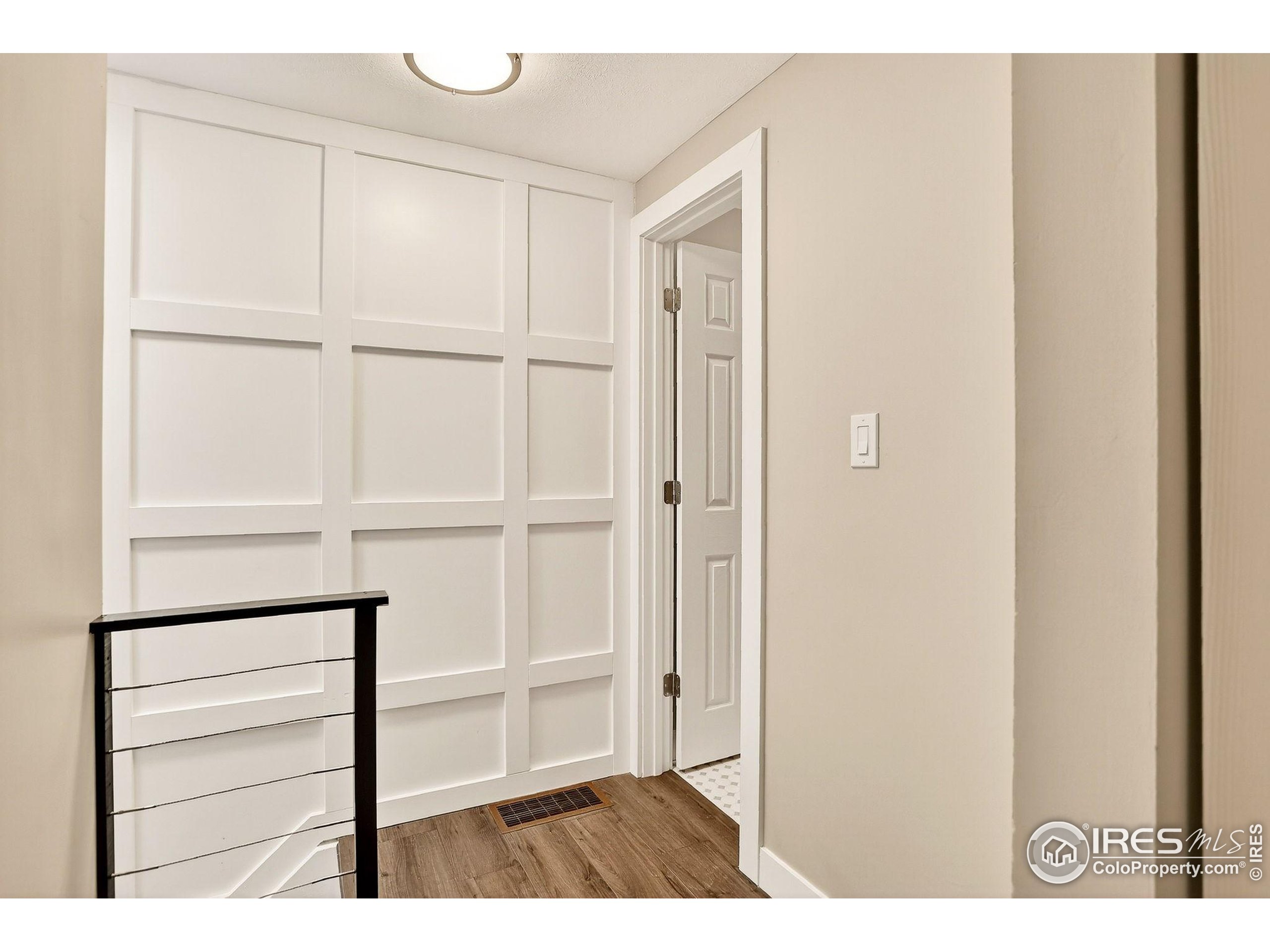 3360 34th Street, Unit B Boulder, CO 80301 - Photo 14 of 22 a view of an empty room with wooden floor