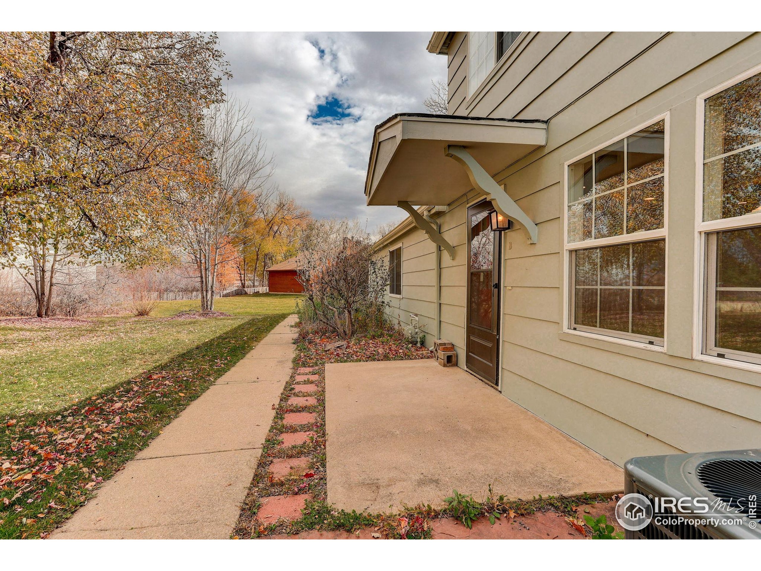 3360 34th Street, Unit B Boulder, CO 80301 - Photo 22 of 22 a front view of a house with a yard