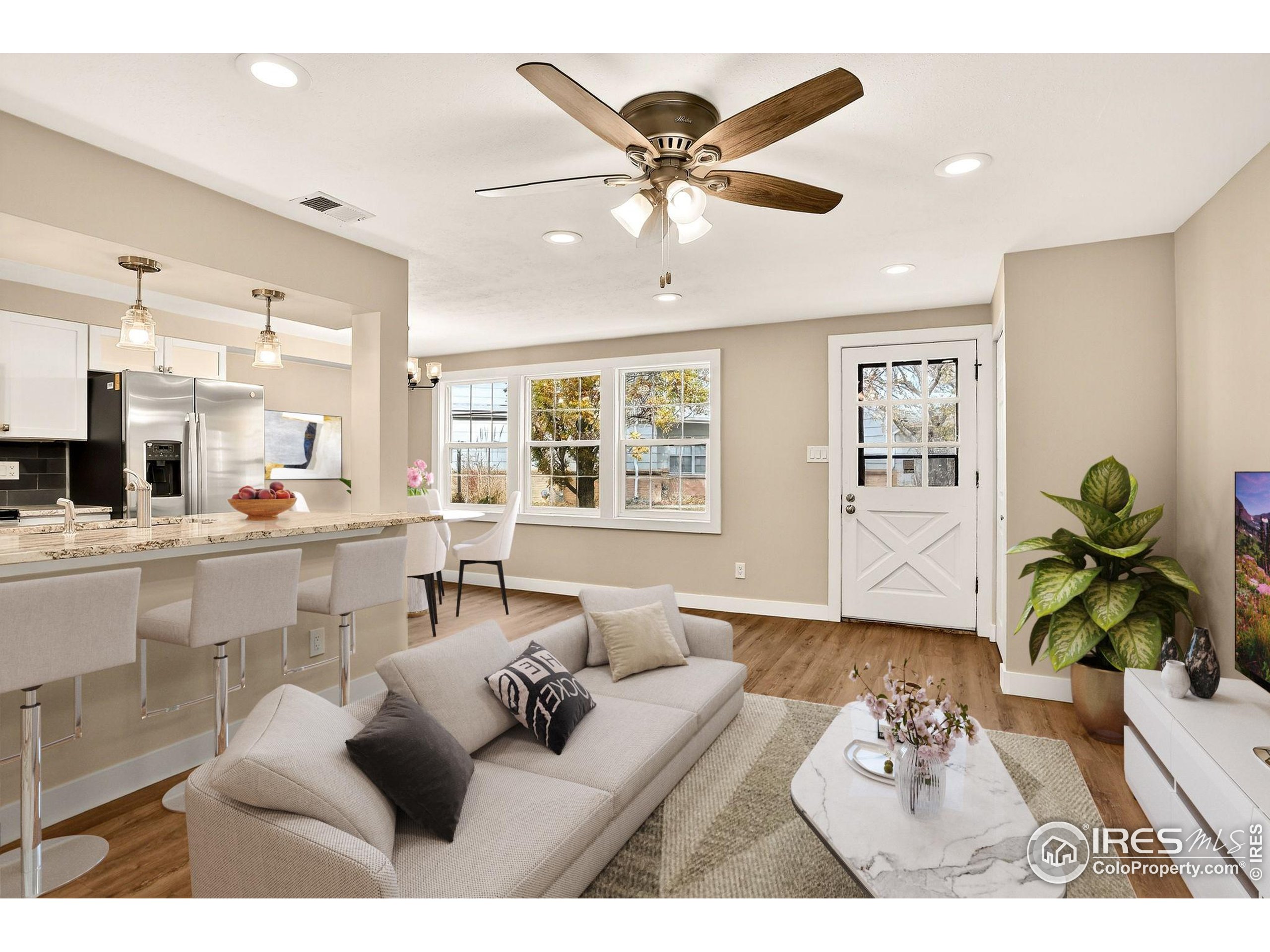 3360 34th Street, Unit B Boulder, CO 80301 - Photo 3 of 22 a living room with furniture and a wooden floor